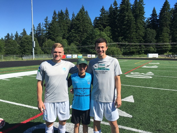 BJ Romac and Jake Young with super fan Kysho Barnhill.